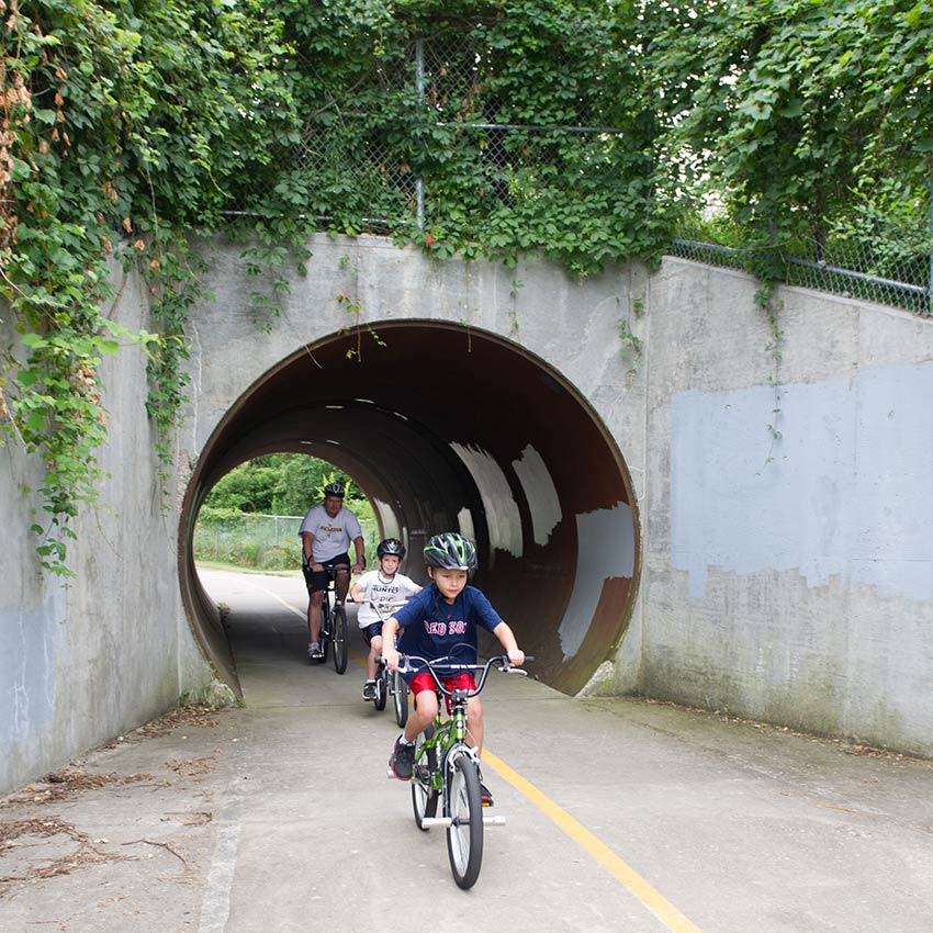 riding bikes through a tunnel